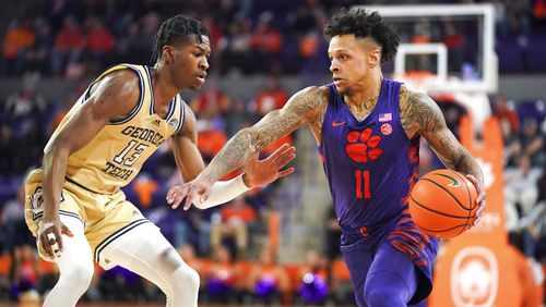 Clemson guard Brevin Galloway (11) drives against Georgia Tech guard Miles Kelly (13) during the first half of an NCAA college basketball game Tuesday, Jan. 24, 2023, in Clemson, S.C. (AP Photo/Sean Rayford)