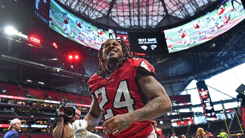 Falcons running back Devonta Freeman leaves with a smile after a win.