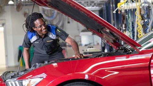 Wage gains have apparently slowed. but metro Atlanta's labor market is still a pretty good place for jobseekers. Here, a technician at CarMax, which has a hiring fair Thursday.,