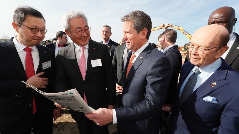 Gov. Brian Kemp meets with top officials of SK Innovation as they break ground on a new plant in Jackson County. Photo: Bob Andres/Atlanta Journal-Constitution