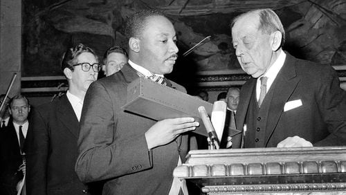 Dr. Martin Luther King Jr., American civil rights leader, receives the Nobel Peace Prize from the hands of Gunnar Jahn, Chairman of the Nobel Committee, in Oslo, Norway, December 10, 1964. (AP Photo)