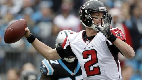 FILE - In this Dec. 24, 2016, file photo, Atlanta Falcons’ Matt Ryan (2) looks to pass against the Carolina Panthers in the first half of an NFL football game in Charlotte, N.C. The Falcons and New England Patriots certainly are seeking the NFL crown on Sunday in Super Bowl 51. (AP Photo/Bob Leverone, File)