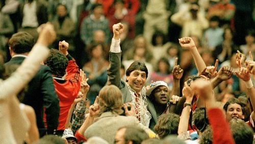 N.C. State coach Jim Valvano with guard Dereck Whittenburg after the Wolfpack upset Houston 54-52 for the 1983 NCAA title.
