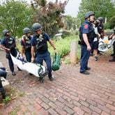 (POLICE TRAINING) Paramedics from the Atlanta Police Department removed victims from a simulated active shooter exercise at the Oakland Cemetery on Thursday, May 18, 2023.Miguel Martinez /miguel.martinezjimenez@ajc.com