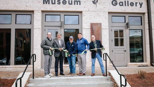 Members of the Sugar Hill City Council celebrate the opening of the city's downtown art gallery and history museum with a ribbon-cutting ceremony on Feb. 25, 2021. (Courtesy City of Sugar Hill)