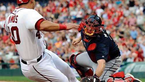 Wilson Ramos of the Washington Nationals is tagged out at home plate by Brian McCann of the Atlanta Braves in the first inning of a game at Nationals Park on Aug. 5, 2013 in Washington, D.C.