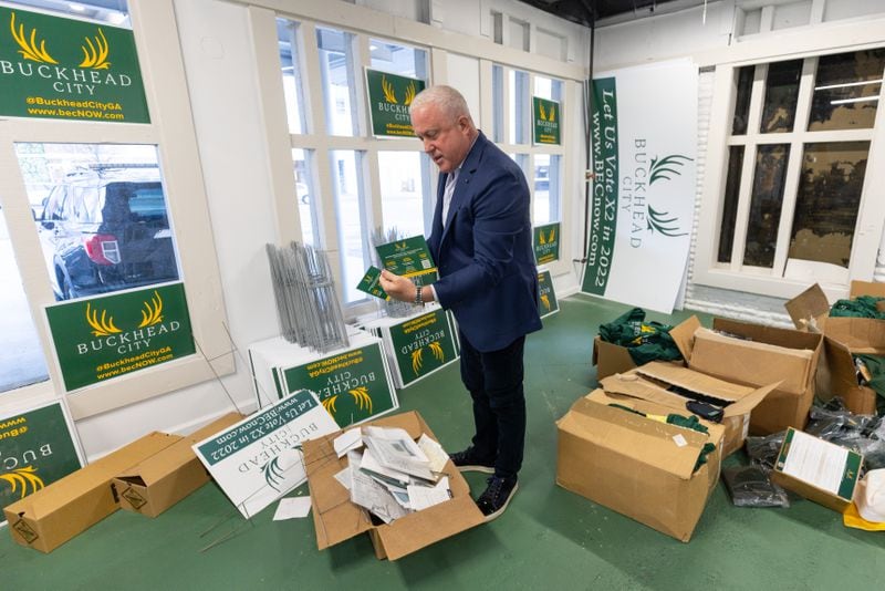 Bill White looks through some of the boxes that are left to move from the Buckhead City Committee headquarters on Thursday, Mar. 30, 2023.  (Steve Schaefer/The Atlanta Journal-Constitution)
