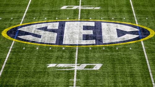 The Southeastern Conference logo is displayed on the field at Mercedes-Benz Stadium. (2019 file photo by ALYSSA POINTER/ALYSSA.POINTER@AJC.COM)