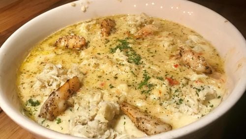 Soul Crab focuses on seafood with a Southern bent. Pictured is its Shrimp and Crab over Grits. LIGAYA FIGUERAS / LFIGUERAS@AJC.COM