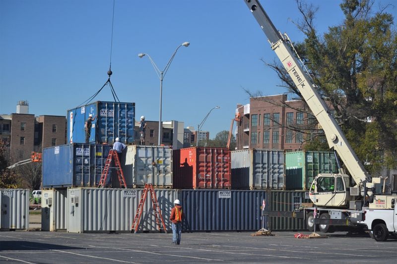 A crane lifts a shipping container into place on the set of the drive-in Alliance Theatre production, "A Christmas Carol: The Live Radio Play." Courtesy of Kathleen Covington