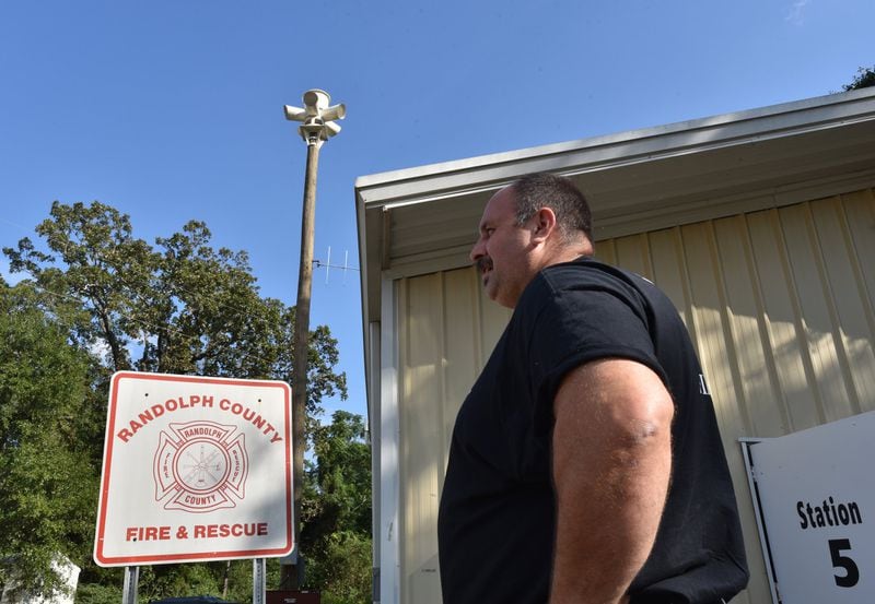 Kenneth Burns, Randolph County emergency management agency director, visits #5 fire station, where a new siren tower has been installed to warn area residents of approaching storms. Roughly half the county’s homes were damaged in 2018 from Hurricane Michael, when the local hospital’s backup generator faltered. (Hyosub Shin / Hyosub.Shin@ajc.com)