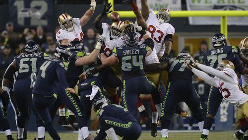 San Francisco 49ers leap but fail to block a field goal kick by Seattle Seahawks kicker Steven Hauschka (4) in the fourth quarter of the NFC championship game at CenturyLink Field in Seattle on Sunday, Jan. 19, 2014. The Seattle Seahawks defeated the San Francisco 49ers, 23-17. (Jose Carlos Fajardo/Bay Area News Group/MCT)