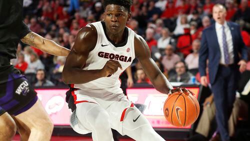Georgia's Anthony Edwards (5) moves the ball against a Western Carolina defender during an NCAA college basketball game Tuesday, Nov. 5, 2019, in Athens, Ga. (Joshua L. Jones/Athens Banner-Herald via AP)