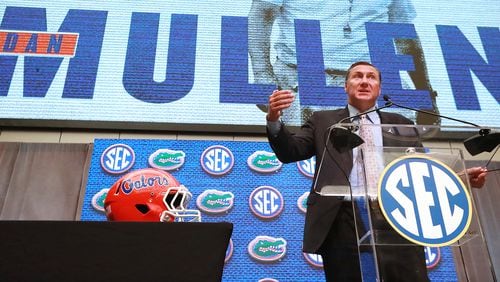 The background to Dan Mullen's press conference is all Florida colors now. (Curtis Compton/ccompton@ajc.com)