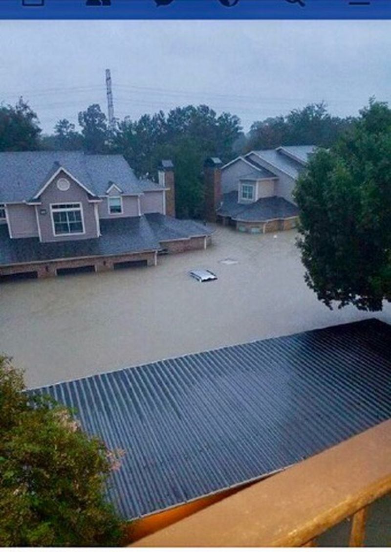 The apartment home of Josh Pastner’s parents, which is the unit set behind the other units in the center of the photo, has been deluged by the flooding in Houston. The top of Hal Pastner’s car is visible in the center of the photo.