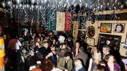 The bar scene at Raoul’s during it's 40th anniversary party in the in New York, Dec. 8, 2015. Opened in 1975, the low-key French bistro on Prince Street continues to be a refuge for SoHo’s bohemian old guard and younger scene makers.