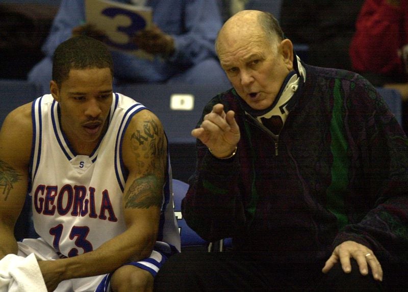 Georgia State's Lefty Driesell, right, on the bench with player Kevin Morris, left, coached after undergoing spinal surgery. 