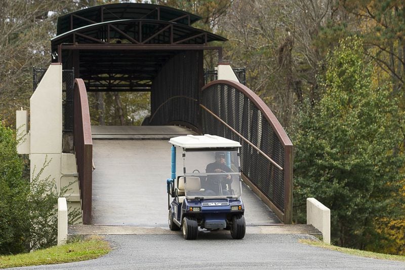 Peachtree City was one of the early communities in metro Atlanta to embrace golf carts as one of its modes of transportation. Across much of the city, residents use golf carts to get around, often driving on designated trails alongside main roadways. (ALYSSA POINTER/ALYSSA.POINTER@AJC.COM)