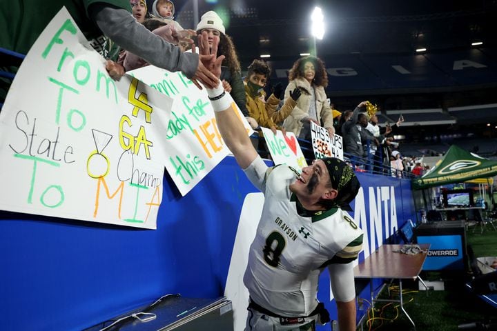 Dec. 30, 2020 - Atlanta, Ga: Grayson quarterback Jake Garcia (8) celebrates with his family and friends after their 38-14 win against Collins Hill during the Class 7A state high school football final at Center Parc Stadium Wednesday, December 30, 2020 in Atlanta. JASON GETZ FOR THE ATLANTA JOURNAL-CONSTITUTION