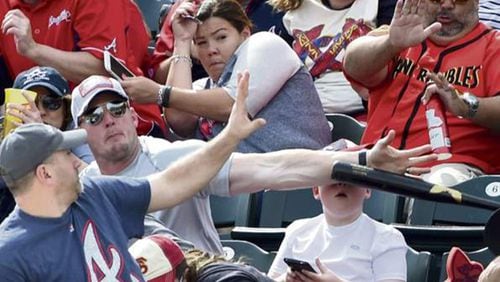 Pittsburgh photographer Chris Horner captured this image of bat flying toward young Braves fan during Saturday's game in Lake Buena Vista, Fla.
