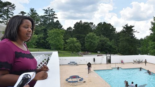 TC Brown, regional manager with Yes! Communities, shows off the swimming pool at Smoke Creek, a manufactured home community south of Snellville. Yes files for eviction far more than at nearly twice the average rate for metro Atlanta. HYOSUB SHIN / HSHIN@AJC.COM