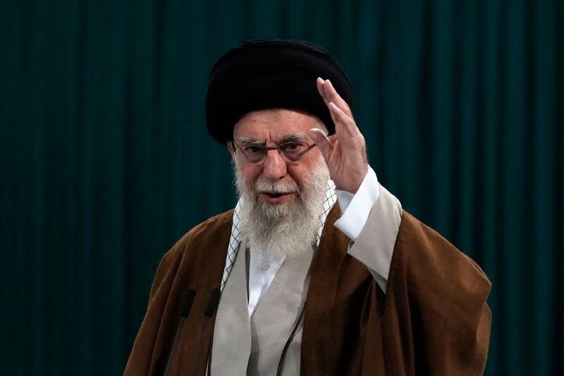 Iranian Supreme Leader Ayatollah Ali Khamenei waves to media after he voted for the parliamentary runoff elections, in Tehran, Iran, Friday, May 10, 2024. (AP Photo/Vahid Salemi)