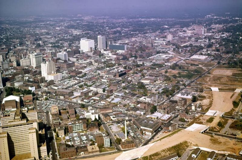 In another aerial view of the Sweet Auburn neighborhood from 1961, construction of the Downtown Connector continues, with much of the grading completed but before the building of the initial four-lane expressway. Landmarks such as the Sweet Auburn Market and the Butler Street YMCA are visible at the bottom center. (Floyd Jillson / AJC Archive at GSU Library AJCNS1961-10-12b)
