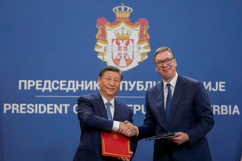Chinese President Xi Jinping, left, shakes hands with Serbian President Aleksandar Vucic at the Serbia Palace, in Belgrade, Serbia, Wednesday, May 8, 2024. (AP Photo/Darko Vojinovic)