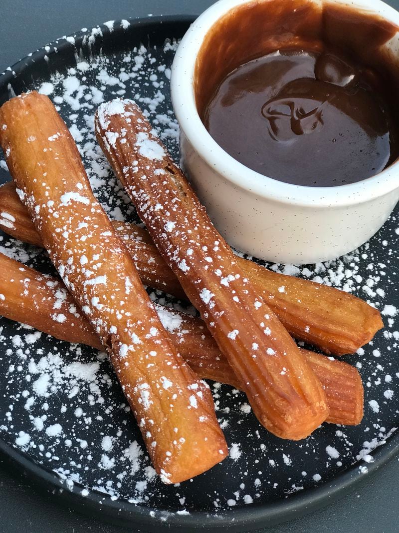 Churros are one of the dessert offerings at Botica. Courtesy of Botica