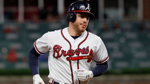 Freddie Freeman rounds third after his solo home run, his 20th of the season, in Tuesday's 10-2 loss to the Mets at SunTrust Park. (Photo by Kevin C. Cox/Getty Images)