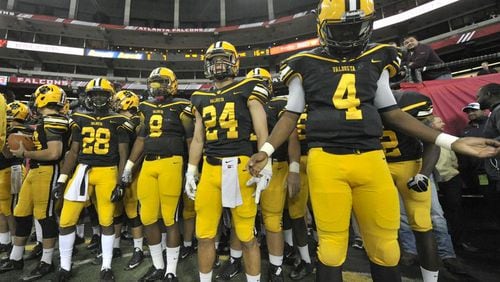 Atlanta, Ga. -- Valdosta senior QB Josh Belton (4) waits to take the field with Wildcat teammates before the start of thier Class AAAAAA state title game against the Tucker Tigers at the Georgia Dome Friday, December 9, 2016. SPECIAL/Daniel Varnado