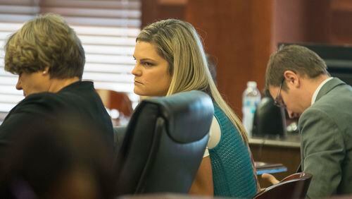 7/26/2019 -- McDonough, Georgia -- Jennifer Rosenbaum (center) looks toward her attorney, Corinne Mull (left), before the start of the days' trial for her and her husband, Joseph Rosenbaum, in front of Henry County Judge Brian Amero at the Henry County Superior courthouse, Friday, July 26, 2019. (Alyssa Pointer/alyssa.pointer@ajc.com)