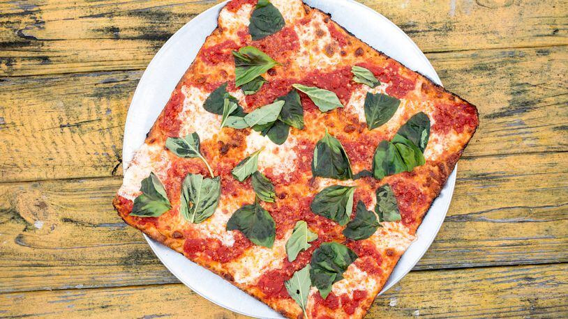 The Grandma Pie at O4W Pizza in Duluth is a chewy, crispy, saucy, cheesy study in delicious simplicity. CONTRIBUTED BY MIA YAKEL / STYLING BY ANTHONY SPINA