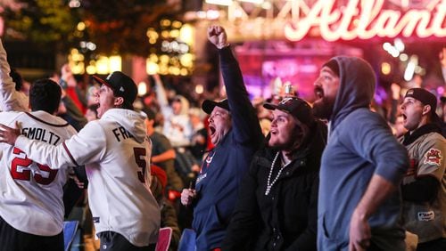 Braves fans cheer during a watch party at The Battery at Truist Park after Jorge Soler hits a home run to open Game 1 of the World Series on Tuesday.