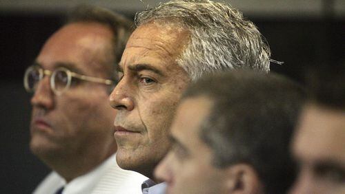 In this July 30, 2008, file photo, Jeffrey Epstein, center, appears in court in West Palm Beach, Fla.