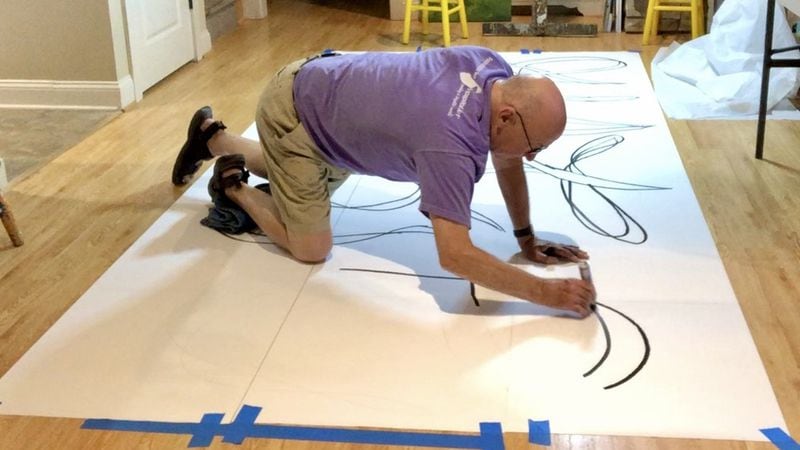 John Feight works on the Just Love mural design in his home studio. Photo contributed by John Feight
