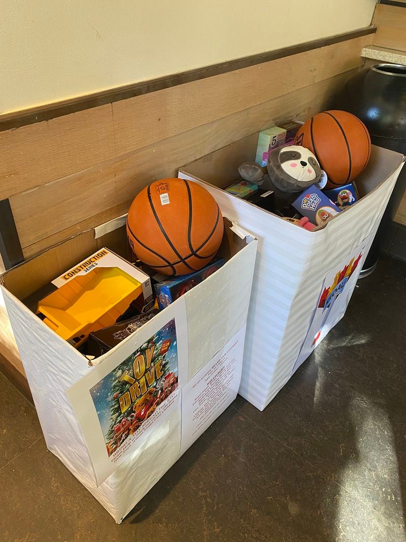 Donation bin inside Starbucks filled with toys such as trucks, stuffed animals and basketballs. Taken on Oct. 27, 2021. Courtesy of Lucretia Cooper