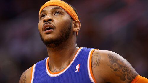 Carmelo Anthony #7 of the New York Knicks during the NBA game against the Phoenix Suns at US Airways Center on March 28, 2014 in Phoenix, Arizona. The Suns defeated the Knicks 112-88. NOTE TO USER: User expressly acknowledges and agrees that, by downloading and or using this photograph, User is consenting to the terms and conditions of the Getty Images License Agreement. (Photo by Christian Petersen/Getty Images)