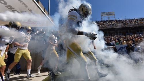 Georgia Tech Yellow Jackets players run on to the field before their game against the Pittsburgh Panthers at Bobby Dodd Stadium on Saturday, October 17, 2015. HYOSUB SHIN / HSHIN@AJC.COM