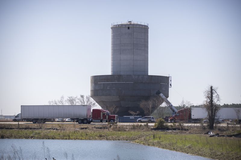 A water tower under construction, center, at the edge of the Hyundai Metaplant site that will be used to hold groundwater pumped from Bulloch County is shown on Wednesday, Feb. 21, 2024 near Ellabell, Ga. (AJC Photo/Stephen B. Morton)