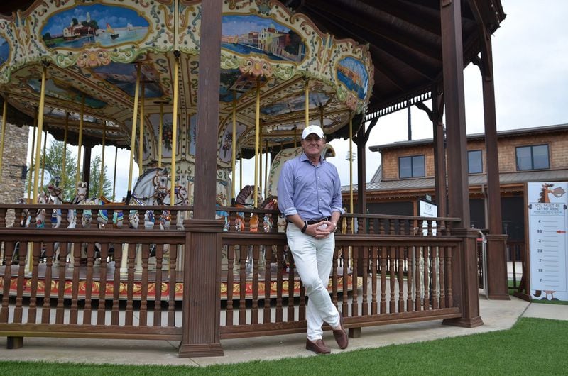 Mark Bellissimo, developer and founder of the Tryon International Equestrian Center in North Carolina, stands in front of an elaborate carousel meant to entertain the youngest visitors. CONTRIBUTED BY WESLEY K.H. TEO