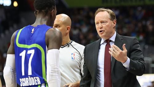 Atlanta Hawks head coach Mike Budenholzer speaks with guard Dennis Schroder before benching him in the third quarter for the remainder of the game against the Golden State Warriors during a NBA basketball game on Monday, March 6, 2017, in Atlanta. Curtis Compton/ccompton@ajc.com