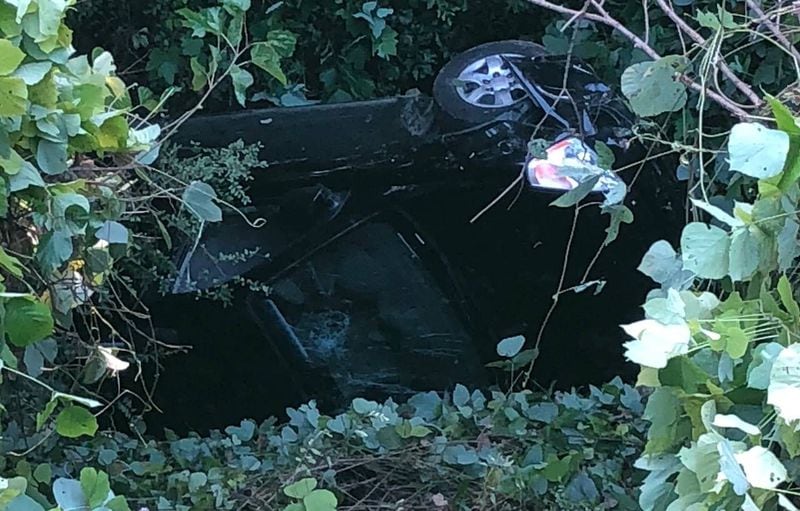 The two suspects’ car fell down a 50-foot embankment, police said. (Photo: Morrow Police Department)
