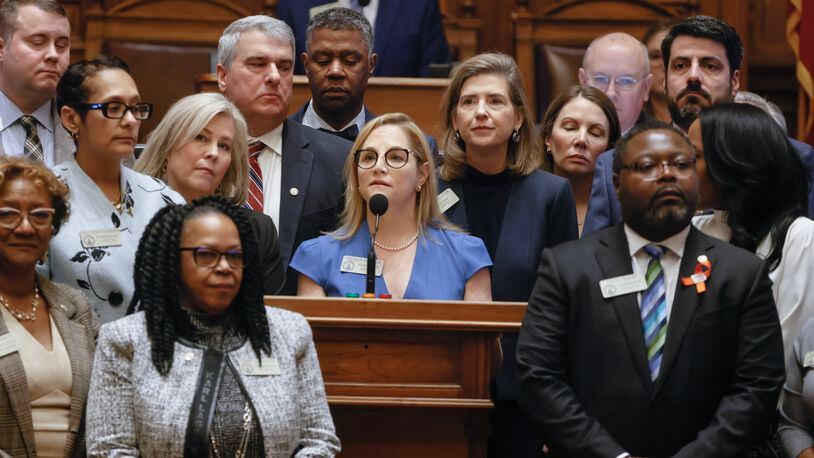 Surrounded by members of the House of Representatives,  Rep. Esther Panitch (D-51) addresses the recent  antisemitic attacks in Atlanta on Monday, February 6, 2023.  (Natrice Miller/natrice.miller@ajc.com) 