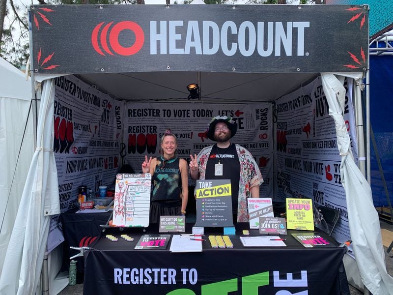 Volunteers register concertgoers for Headcount, a nonprofit organization. (Phoebe Quinton/ The Atlanta Journal-Constitution)