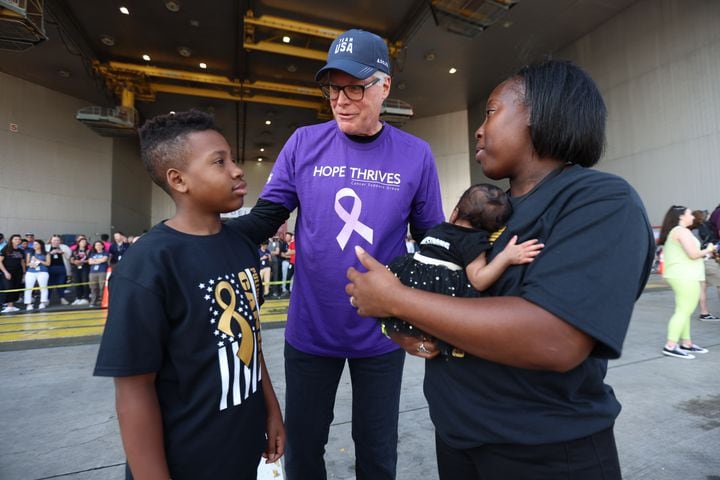 Delta CEO Ed Bastian talks to Dre Johnson and her mom Sherice Johnson during the fundraising Relay for Life and Jet Drag event on Wednesday, May 4. 2022. Sherice participates with the "Drestrong" team named after her son that has cancer. Miguel Martinez / miguel.martinezjimenez@ajc.com