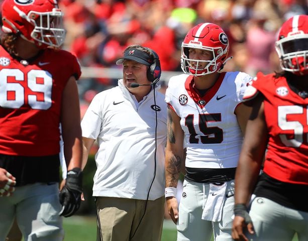 Head coach Kirby Smart confers with Carson Beck between plays during the G-Day game on Saturday, April 13, 2024.  Curtis Compton for the Atlanta Journal Constitution