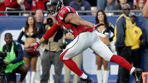 Falcons linebacker Vic Beasley celebrates on his way to scoring a touchdown after a fumble recovery against the Los Angeles Rams in the third quarter at the L.A. Memorial Coliseum Sunday. The Falcons defeated the Rams 42-14. (Jeff Gross/Getty Images)