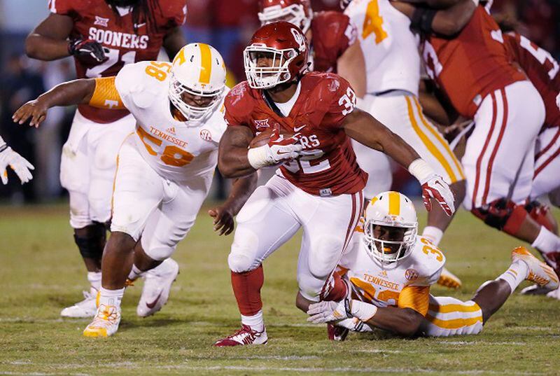 Oklahoma running back Samaje Perine (32) during an NCAA college football game between Tennessee and Oklahoma in Norman, Okla., Saturday, Sept. 13, 2014. (AP Photo/Sue Ogrocki) OU freshman Samaje Perine rushed for 67 yards against UT. (Sue Ogrocki/AP photo)