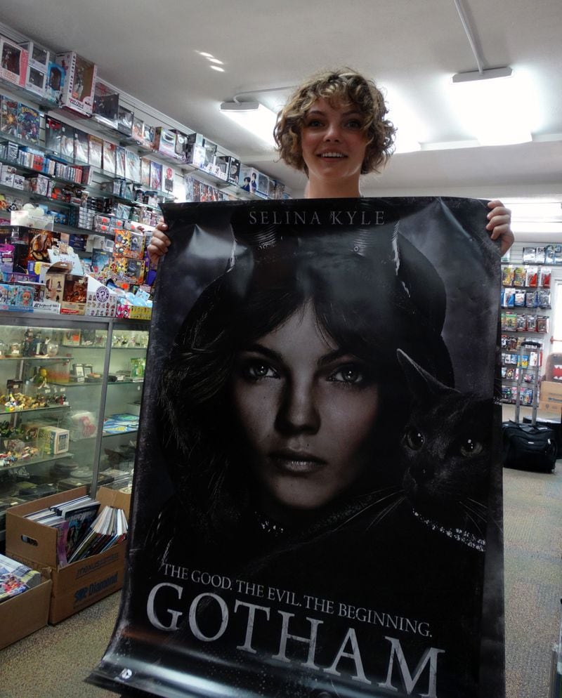 Camren Bicondova shows off a big poster of herself in "Gotham" at Oxford Comics & Books on Piedmont Ave. in Buckhead Sept. 3, 2014. CREDIT: Rodney Ho/rho@ajc.com